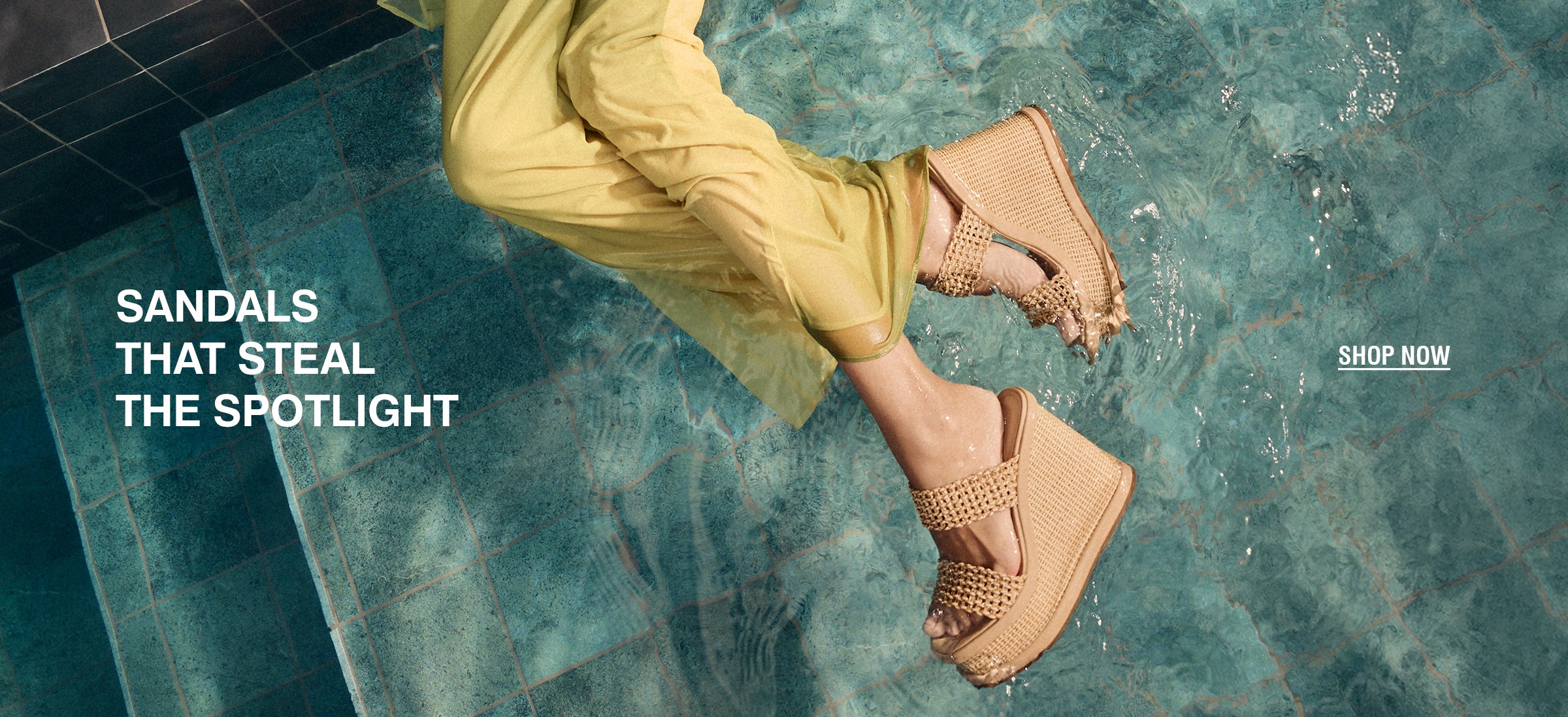 Woman in a yellow dress relaxes bya pool, wearing stylish tan sandals. Text reads "Sandals That Steal theSpotlight." Calm and elegant vibe. 