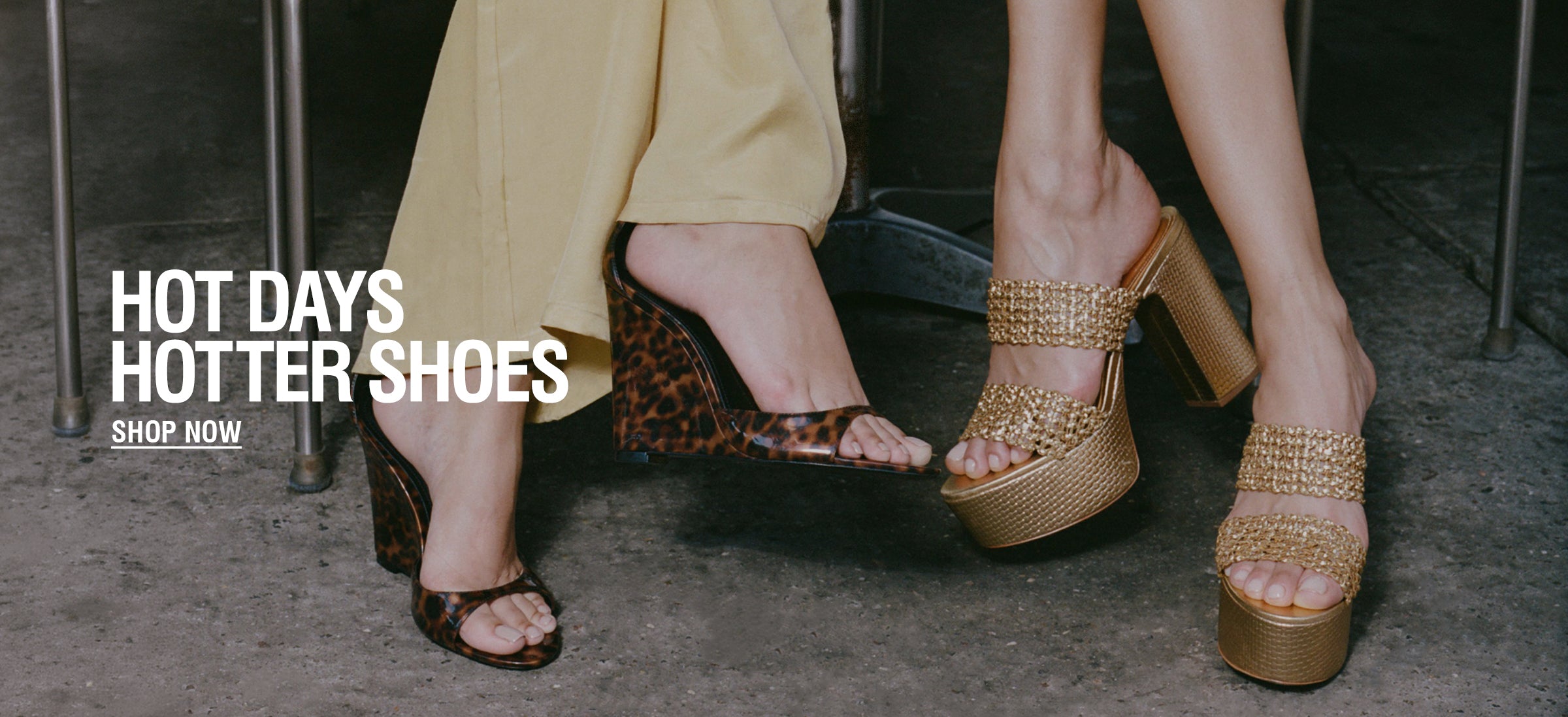 Two women wearing stylish platform high heels: one in leopard print and the other in gold, set against a concrete floor. Text reads "Hot Days, Hotter Shoes, Shop Now."