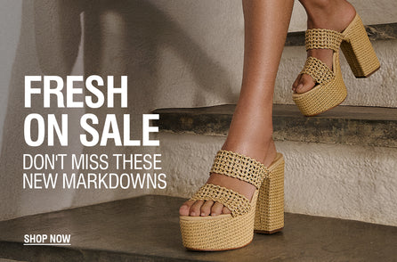 Person wearing woven platform sandals stands on stairs; text reads, 