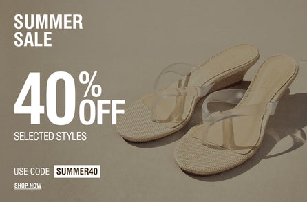 Summer Sale promotional banner featuring a pair of beige slide sandals with clear straps on a neutral background. White text reads: 
