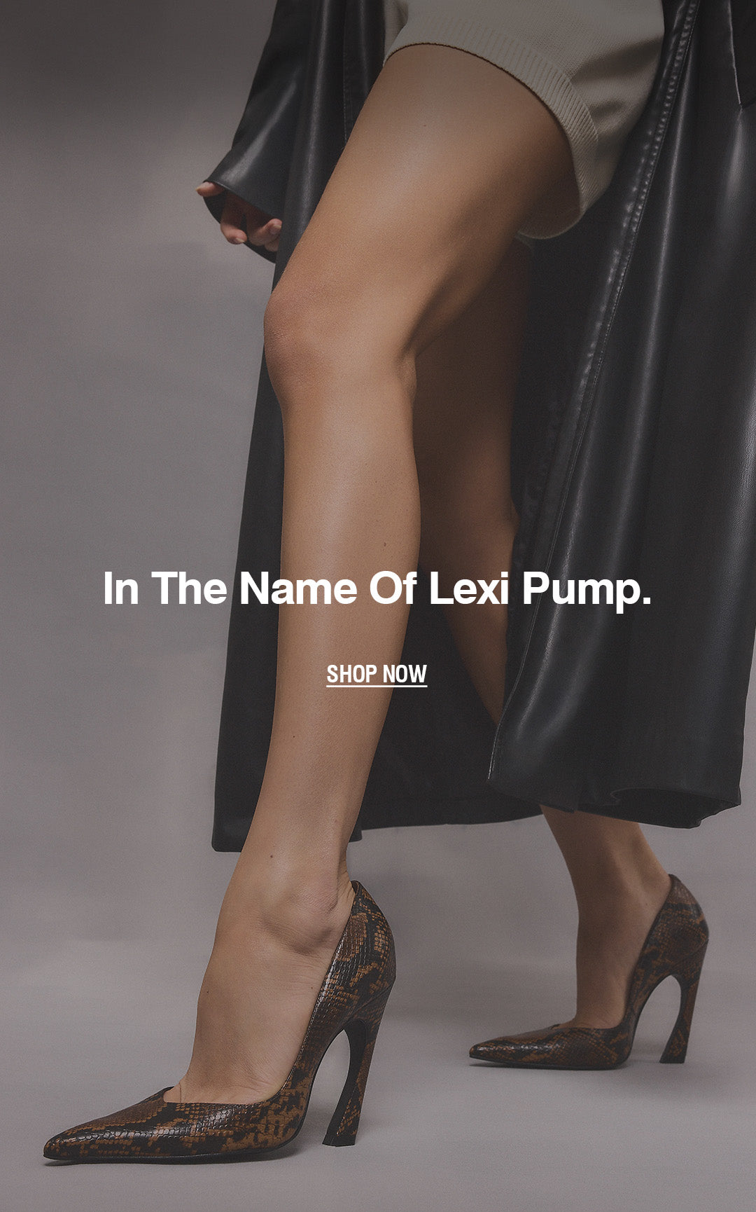 A model's legs wearing brown and black snakeskin-patterned high heels, styled with a black leather coat and beige skirt against a gray studio background. White text overlay reads 'In The Name Of Lexi Pump.