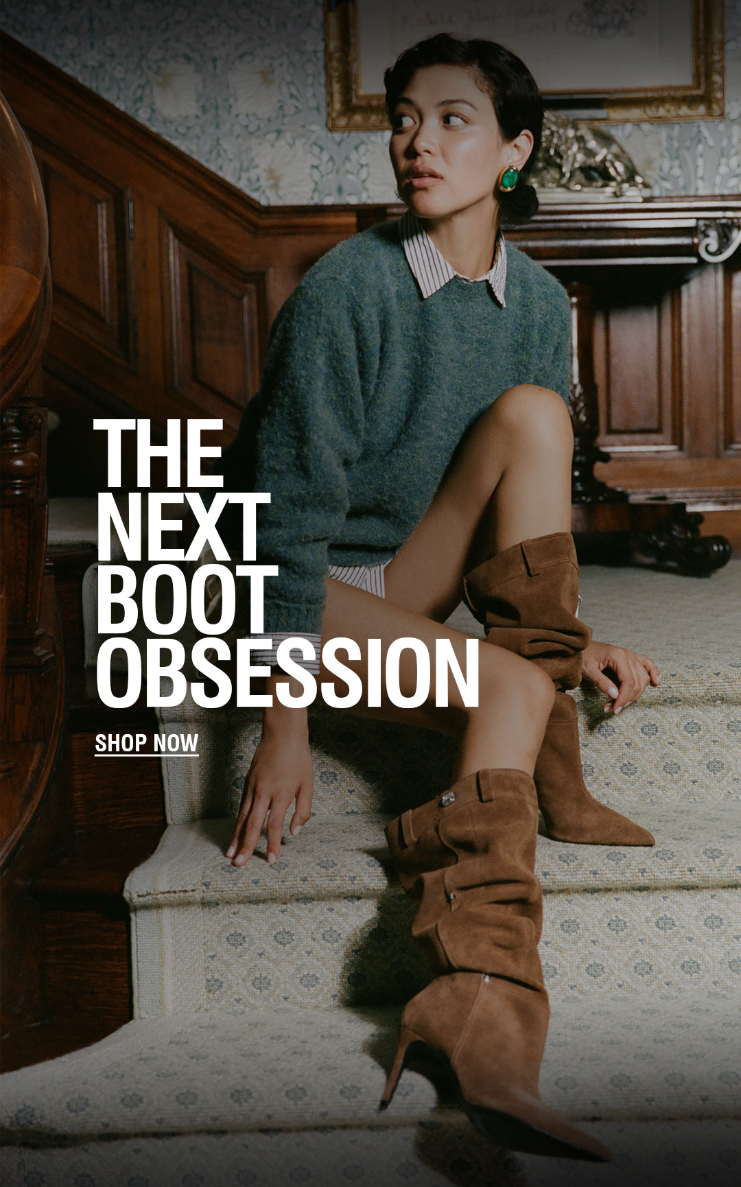 A woman sits on a patterned carpeted staircase in a vintage room, wearing a teal knit sweater, a striped collared shirt, and brown suede knee-high boots. Large white text on the left reads 'THE NEXT BOOT OBSESSION' with 'SHOP NOW' below.