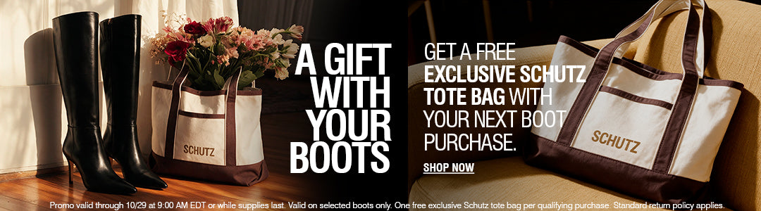 Promotional banner featuring a beige and brown SCHUTZ tote bag, a pair of black knee-high boots, flowers in a matching tote, and text reading 'A GIFT WITH YOUR BOOTS' and 'GET A FREE EXCLUSIVE SCHUTZ TOTE WITH YOUR NEXT BOOT PURCHASE.'.