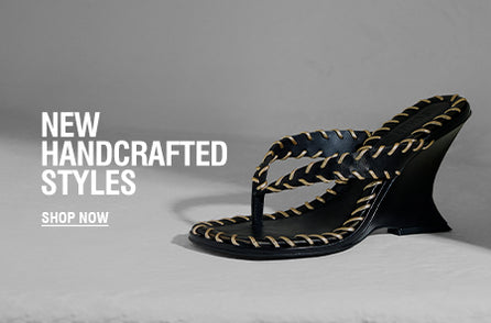 Black handcrafted heeled sandal with braided stitching detail on a neutral background
