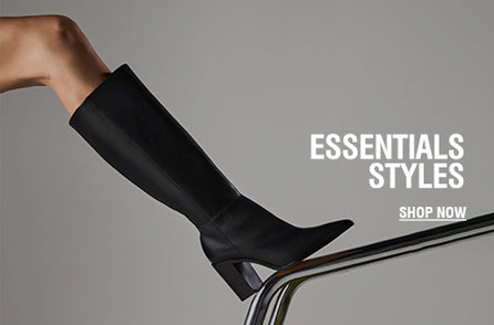 Women’s black knee-high boot with a block heel, displayed on a gray background, featuring the text “Essentials Styles”.