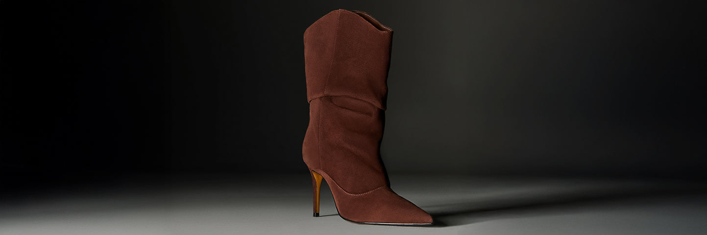 Brown suede high-heeled boot with a pointed toe, displayed against a dark background with the words “SUEDE STYLES” in bold white text on the left.