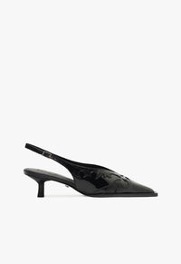 Go to related product Daria Sling Patent Leather Pump