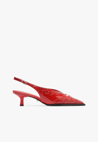 Go to related product Daria Sling Patent Leather Pump
