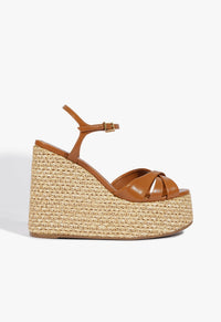 Go to related product Keefa Raffia Wedge Sandal