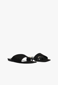 Go to related product Jodie Black Leather Flat Sandal