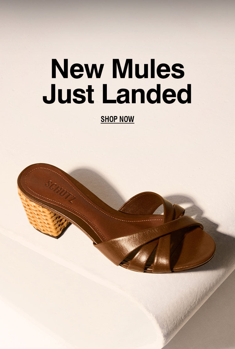 Brown leather mule sandal with braided block heel from Schutz, displayed on a light background with the text "New Mules Just Landed".